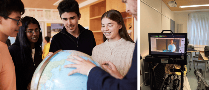A bunch of kids looking at a globe and a monitor.
