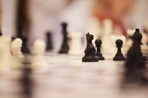 Close up of a chess board with its pieces