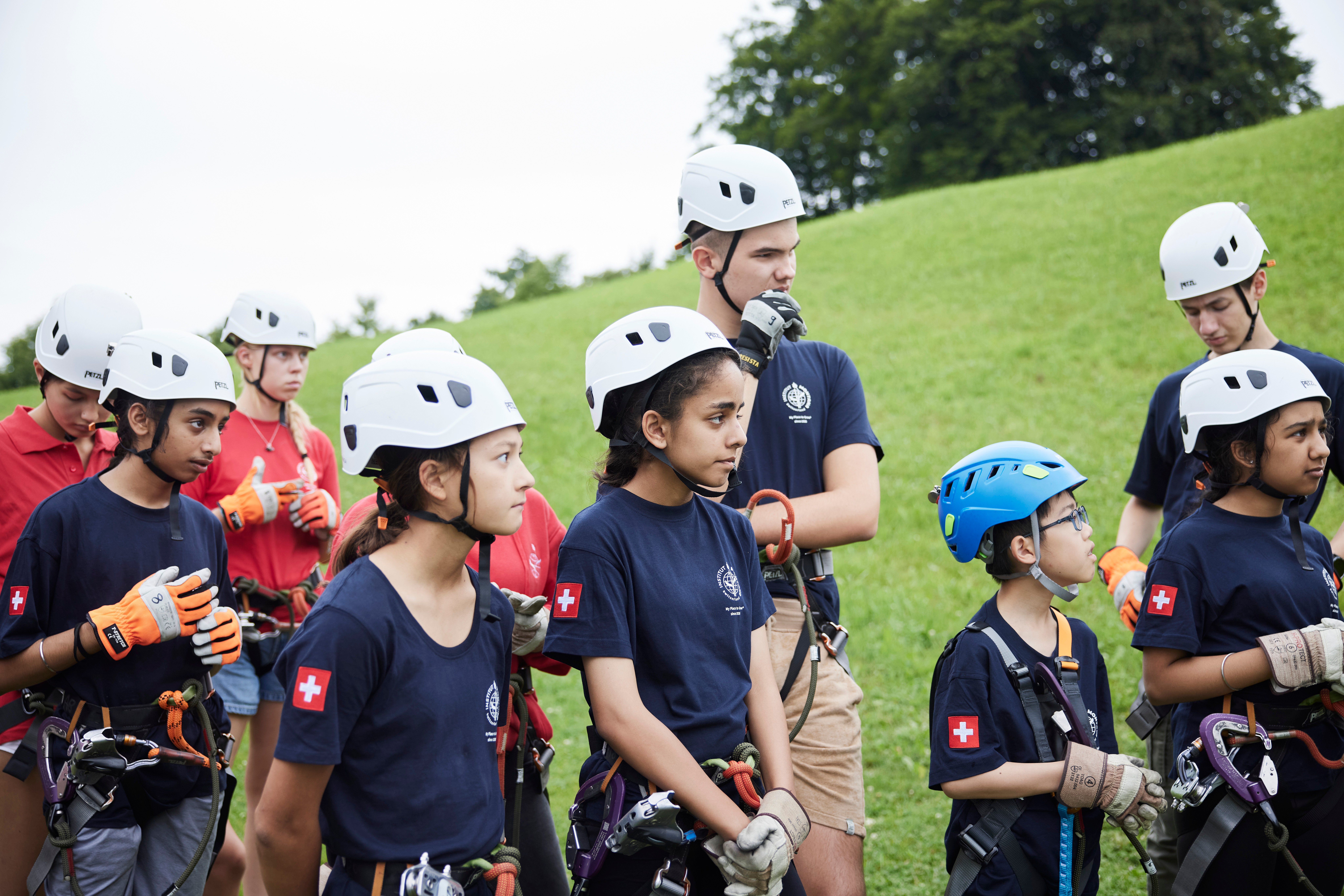 Some kids in helmet on a field