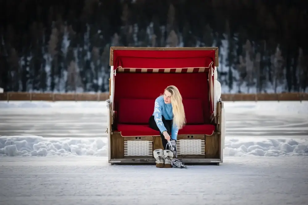 A lady in red chair.