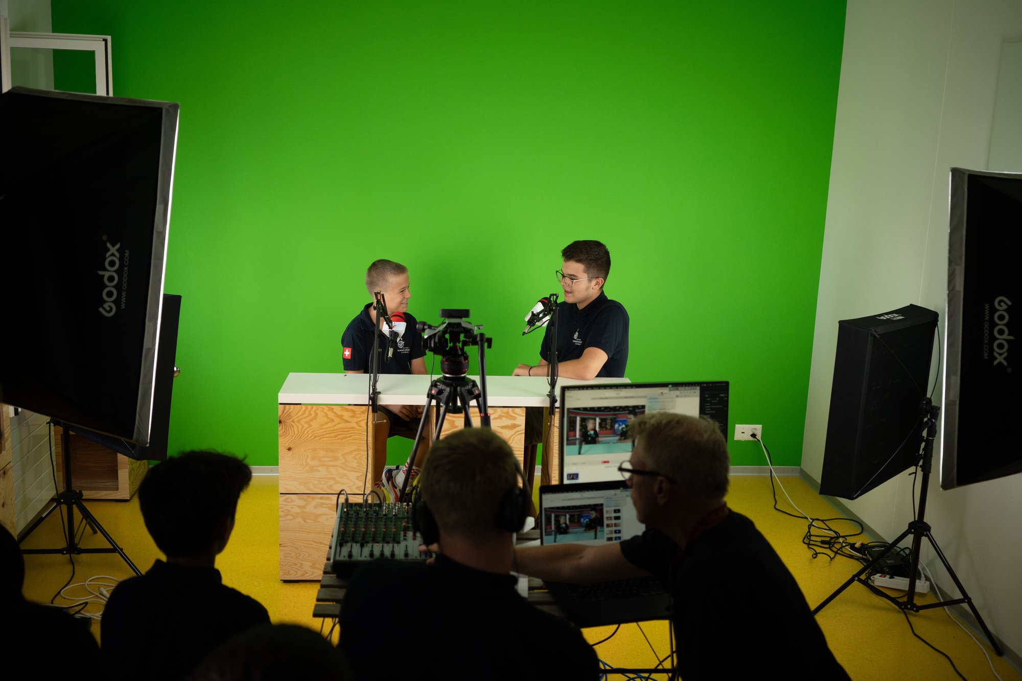 Two male students in a studio.
